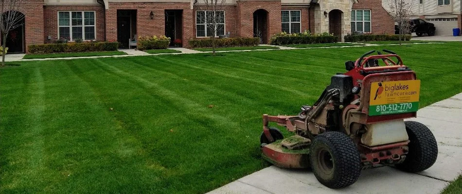 Commercial lawn mower in front of property in Macomb, MI.