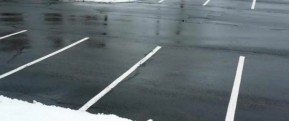 A commercial property's parking lot with snow removal and deicing service in Chesterfield, MI.