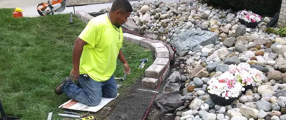 Landscape bed renovation with stone edging near Shelby, MI.