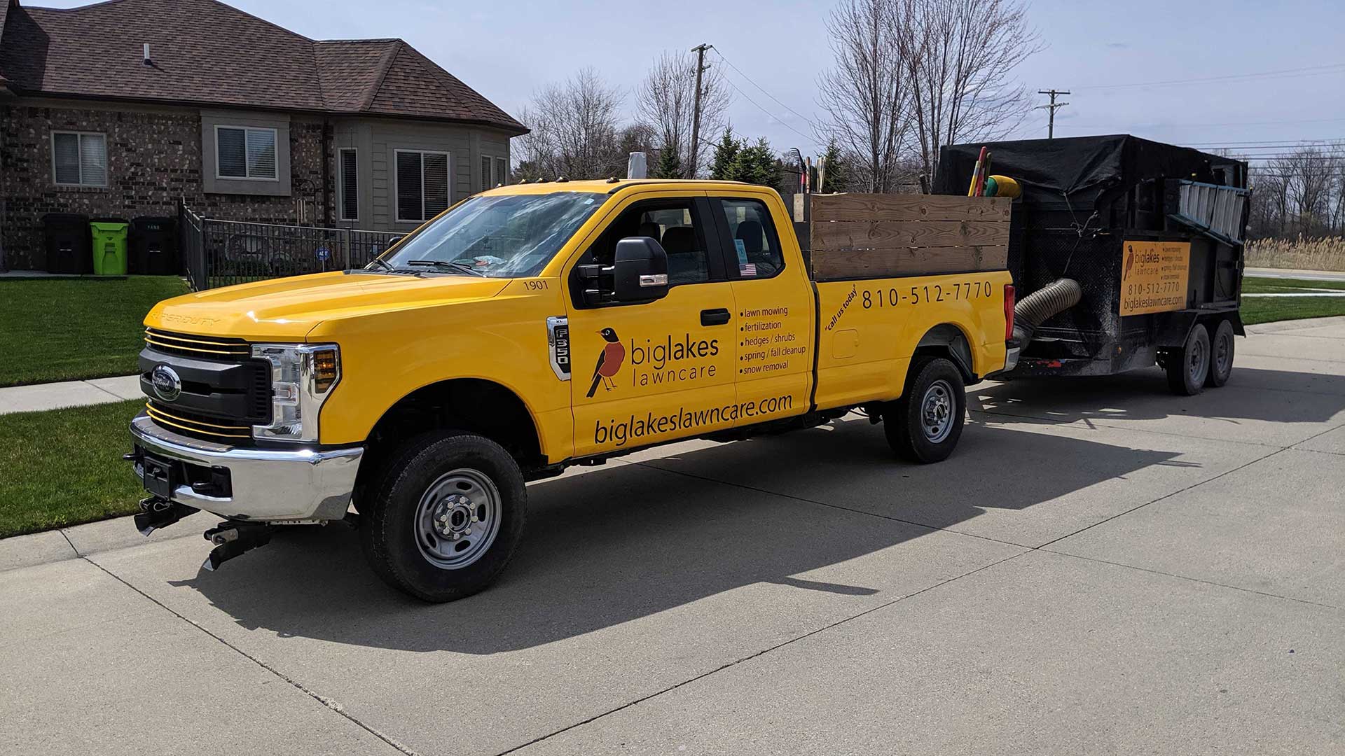 Big Lakes Lawncare work truck servicing a Warren, MI property with lawn care.