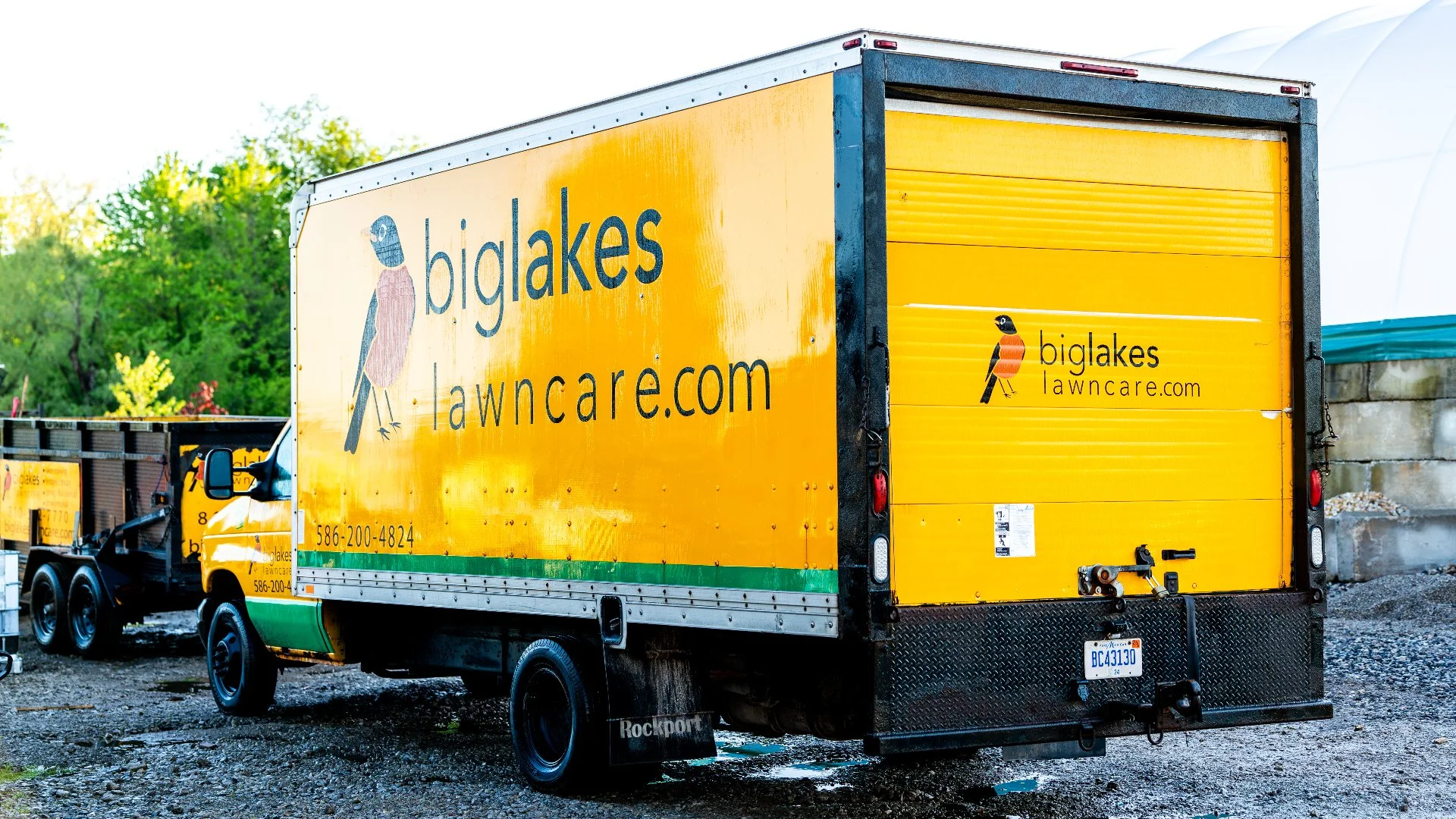 Big Lakes Lawncare yellow landscaping box truck.