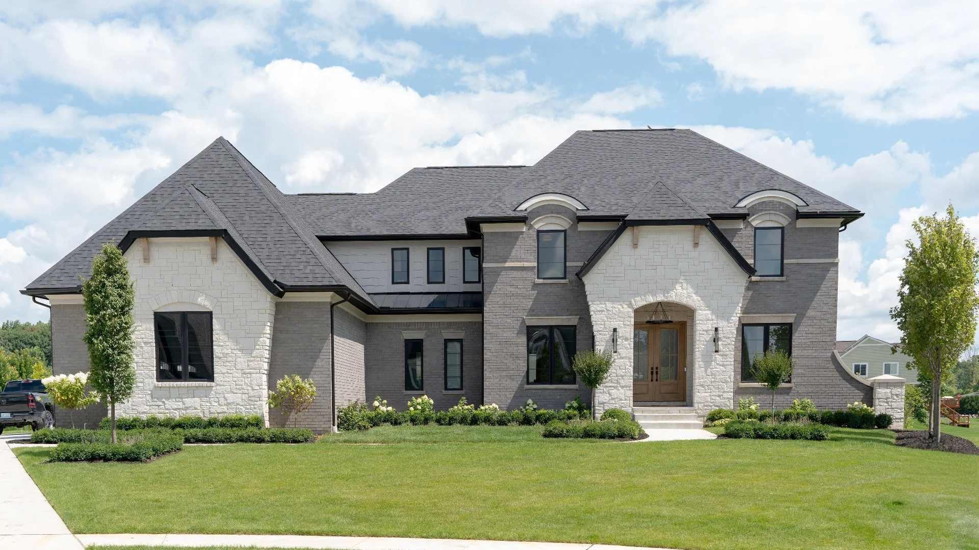 Elegant family house with landscaped lawn in Macomb, MI.