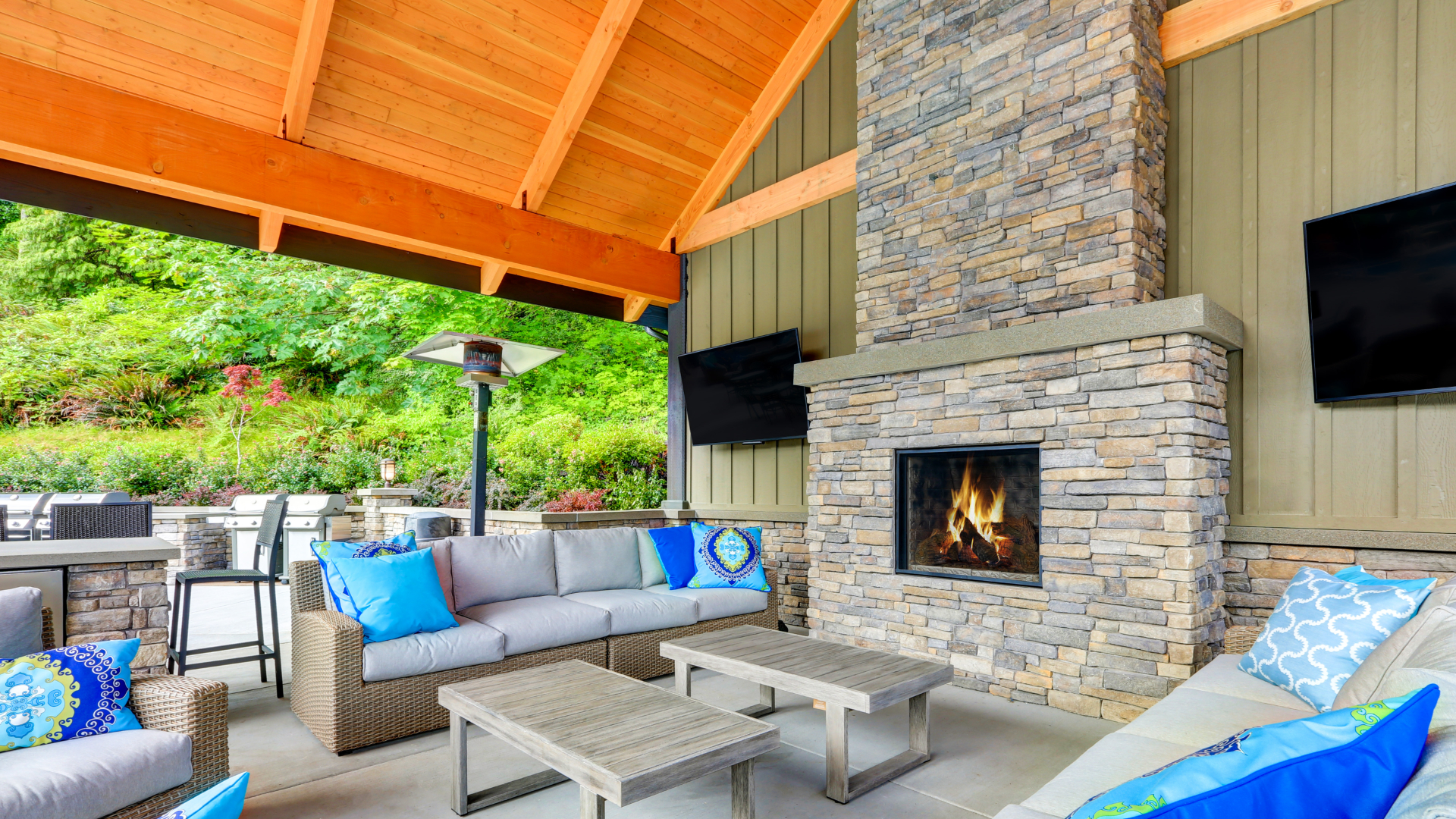 A custom built fireplace underneath a pavilion behind our client's home in Shelby, MI.