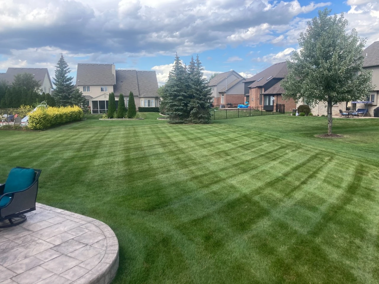 A Shelby, MI home with mowing lines in the front yard.