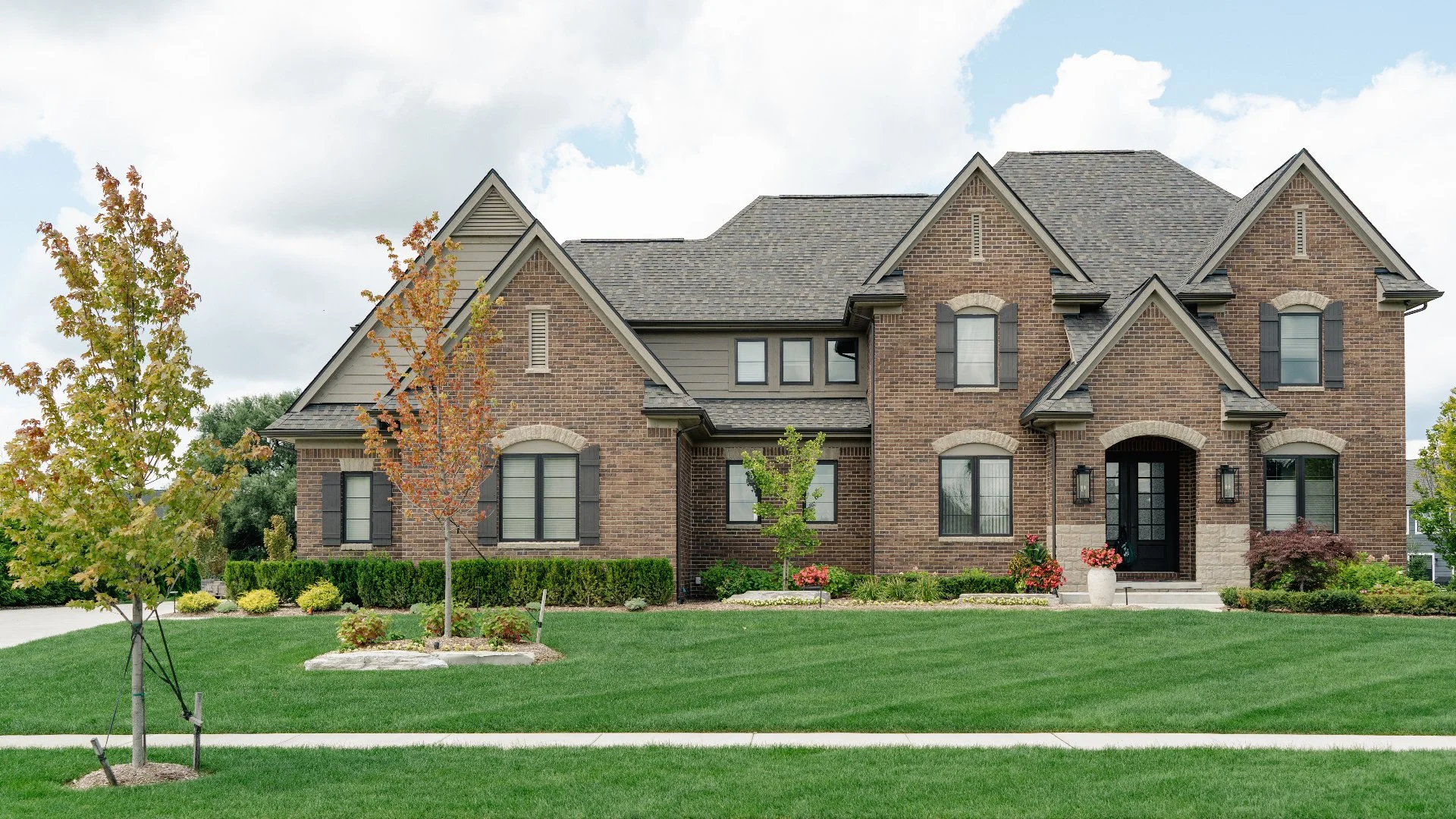 Outdoor Living Space in Washington, MI With a Patio, Fire Pit, Plantings & More