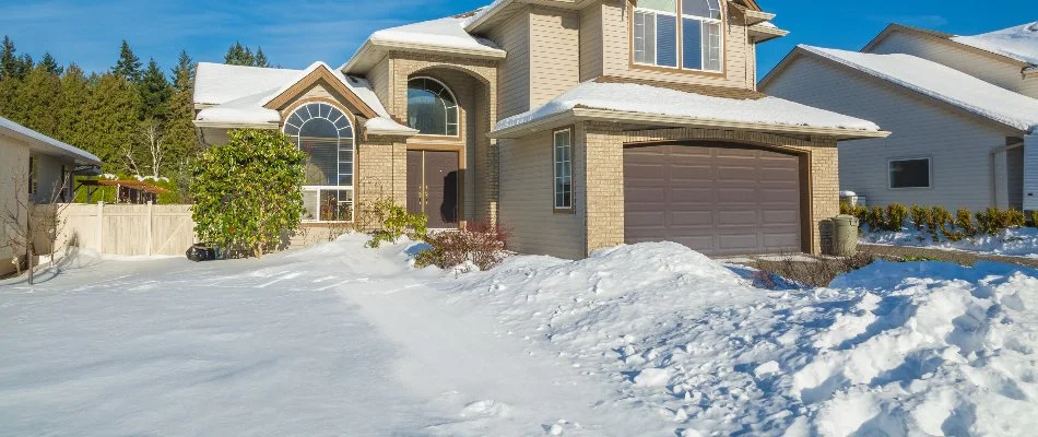 Driveway of a house in Macomb, MI, with snow.