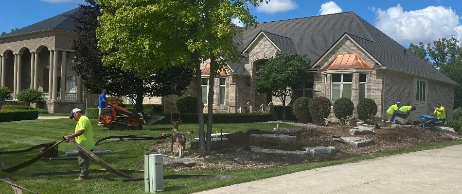 Professionals during a landscape installation in Macomb, MI.