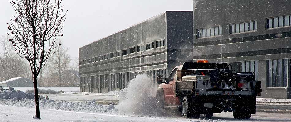 Clearing snow and ice at a commercial property in Macomb, MI.