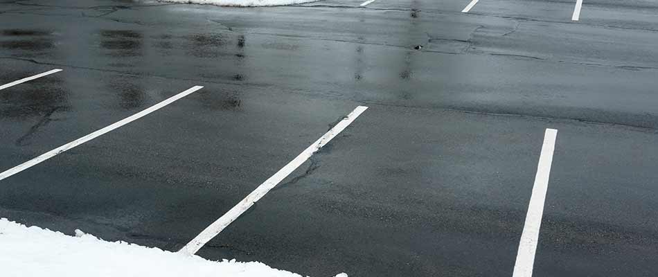 A commercial property's parking lot with snow removal and deicing service in Shelby, MI.