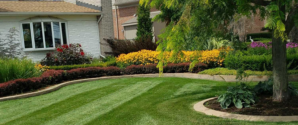 A home in St. Clair Shores with regular landscape trimming and mowing.