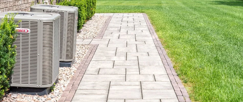 Stone walkway installation and lawn.