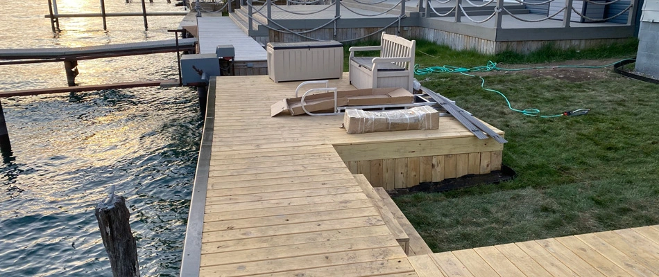 Deck feature installed beside water boat port in Macomb, MI.