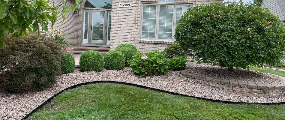 House in Clawson, MI, with a rock landscape and plants.