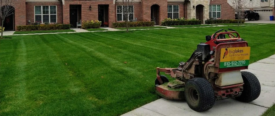 Lawn mower next to a green lawn in Macomb, MI.