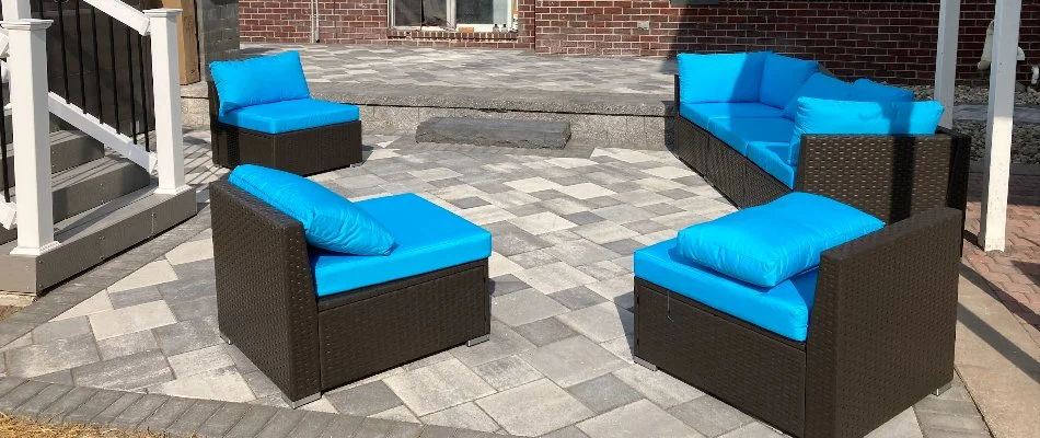 Patio with outdoor furniture with blue cushions in Macomb, MI.