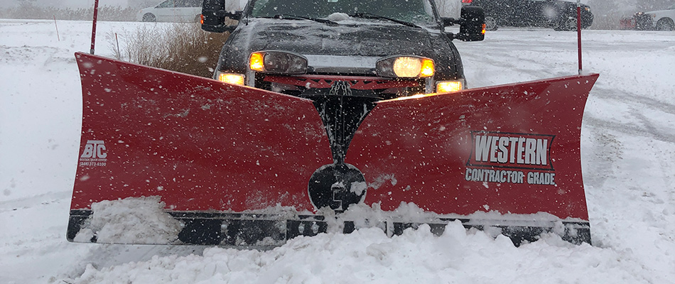 Snow plow truck clearing roads in Ferndale, MI.
