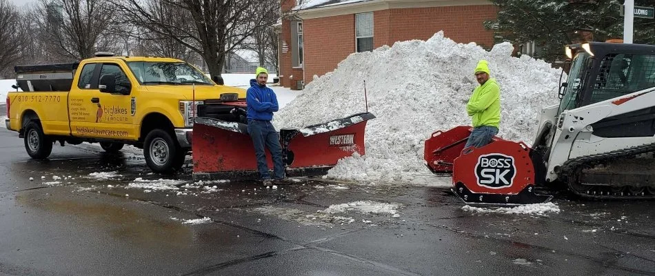 Workers performing snow removal in Oak Park, MI.