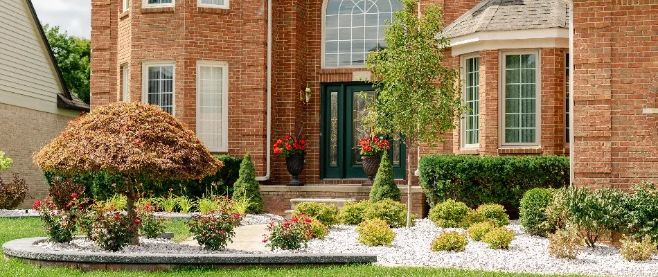 Various plants in front of nice home in Marysville, MI.